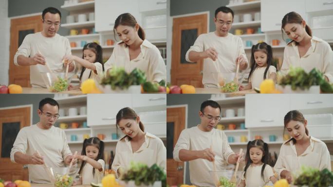 快乐的厨房时刻:亚洲家庭联合一堂有趣的烹饪课程，家长指导孩子制作健康的新鲜蔬菜沙拉。
