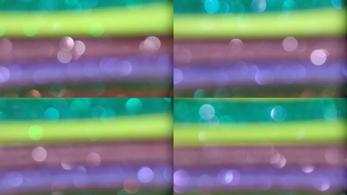 绿黄粉紫散景背景。视频背景散景概念