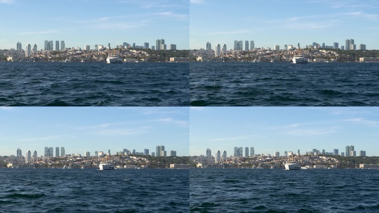 通过博斯普鲁斯海峡的船只，背景是城市景观，伊斯坦布尔，土耳其