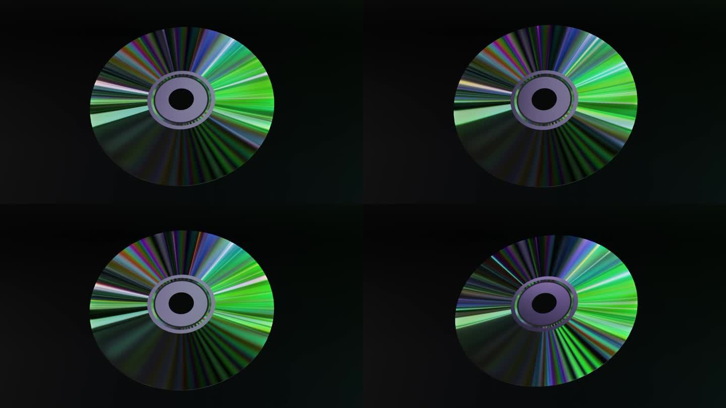抽象的概念。CD DVD在黑色背景上旋转。彩虹。绿色霓虹色。三维动画