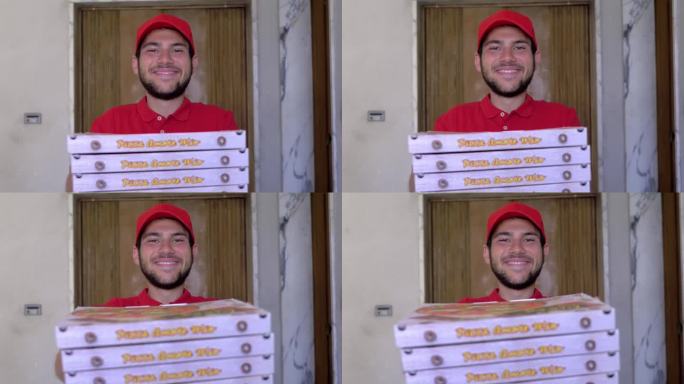 小送货员微笑着把披萨递到镜头前的照片