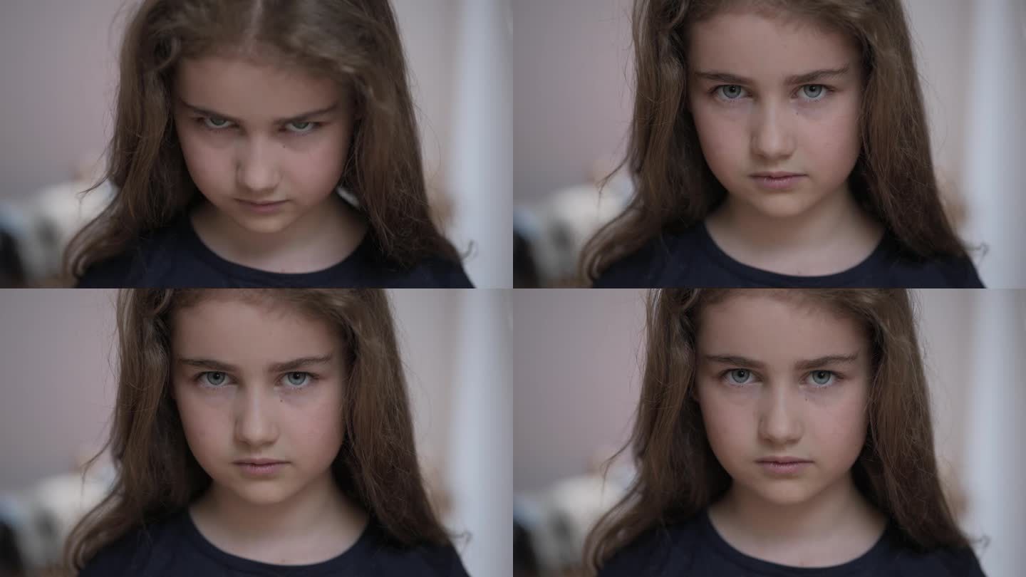 悲伤的思考好奇的孩子看着相机。脸眼睛严肃沉思的女孩。沮丧的女学生的肖像，悲伤，坏心情。沮丧的脸。童年