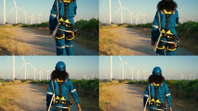 特写:非洲女工程师用太阳能电池设备对风车领域的替代能源进行调查，用于可持续能源研究。