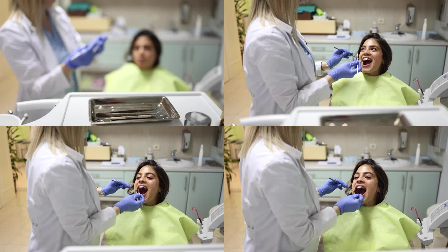 年轻女子接受牙医的治疗