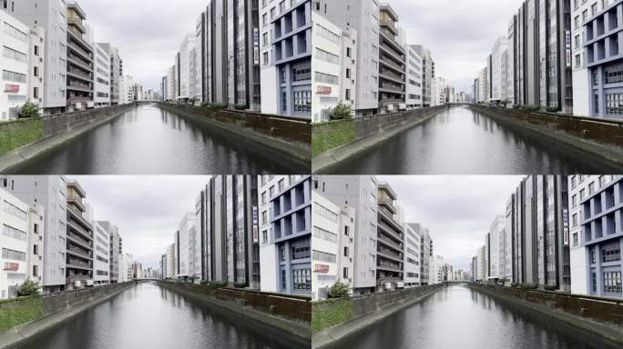 东京宽水渠周围现代建筑的壮丽景色:对称镜头与添加文字和图形的空间