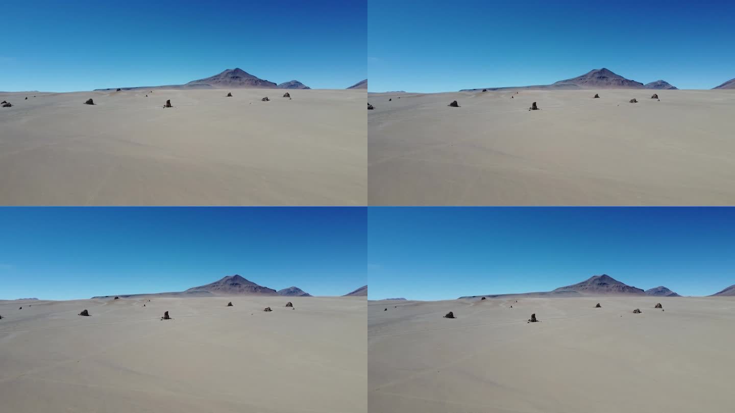 摄像机在玻利维亚西南部的萨尔瓦多达利沙漠的岩层前升起