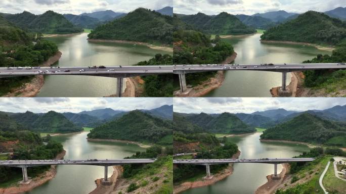 空中无人机高角度观察泰国南部水库或河流上的桥梁。泰国雅拉省Bang Lang Dam上的桥梁道路