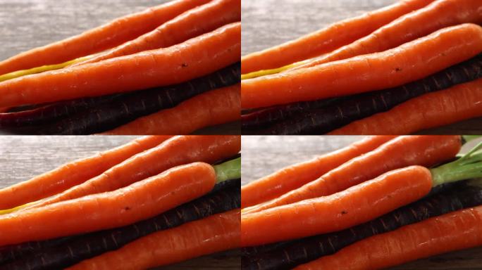 五颜六色的小胡萝卜，木质背景上营养健康的食物。