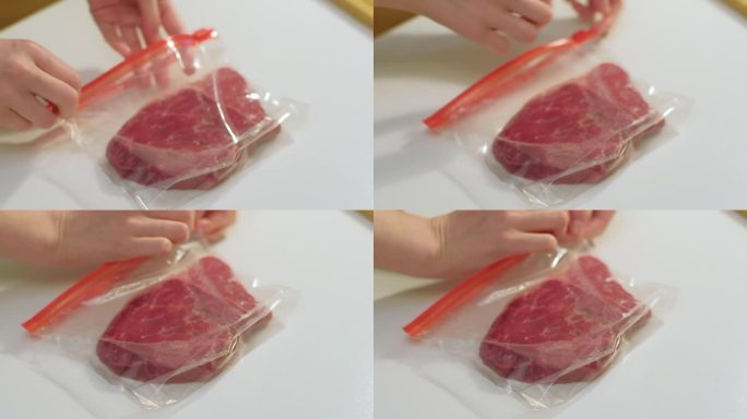 将牛肉装入塑料袋，以便在家冷冻。烹饪食物概念