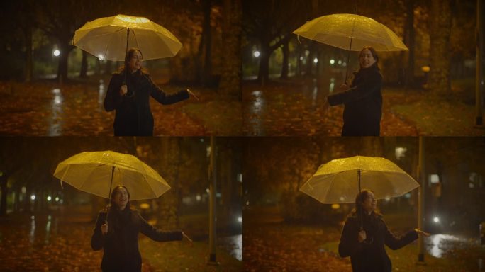 在雨中跳舞的快乐女人们在秋天的公园里享受生活