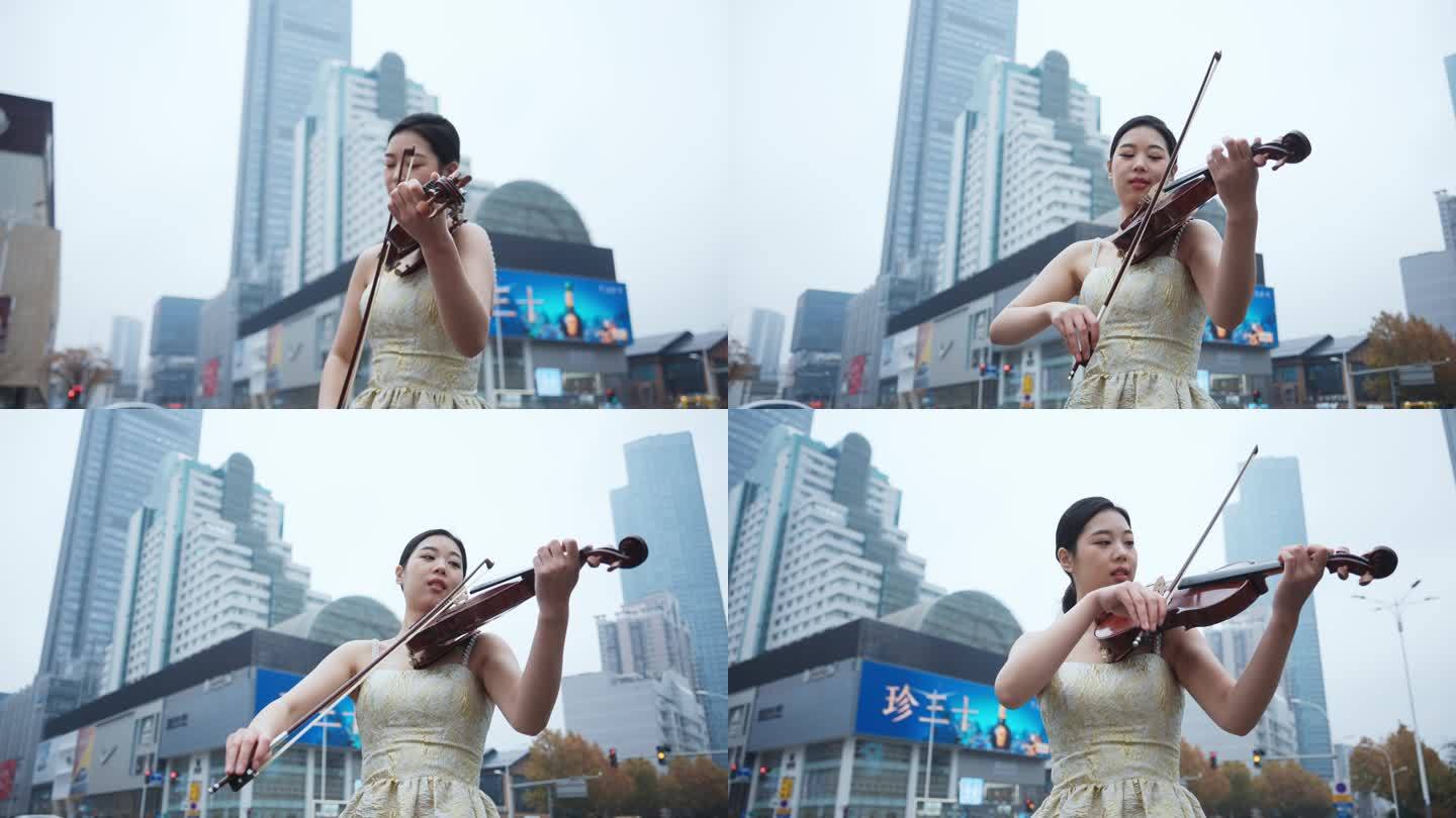 美女在城市街头拉小提琴