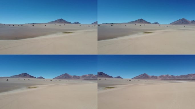 玻利维亚西南部的萨尔瓦多·达利沙漠，背景是典型的岩石和山脉