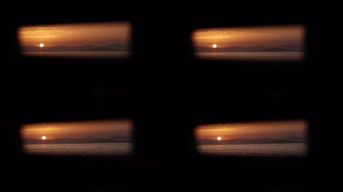 从船的侧窗看日落