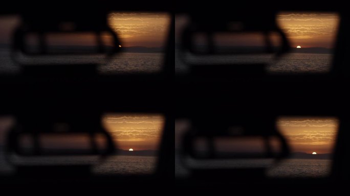 从船的侧窗看日落
