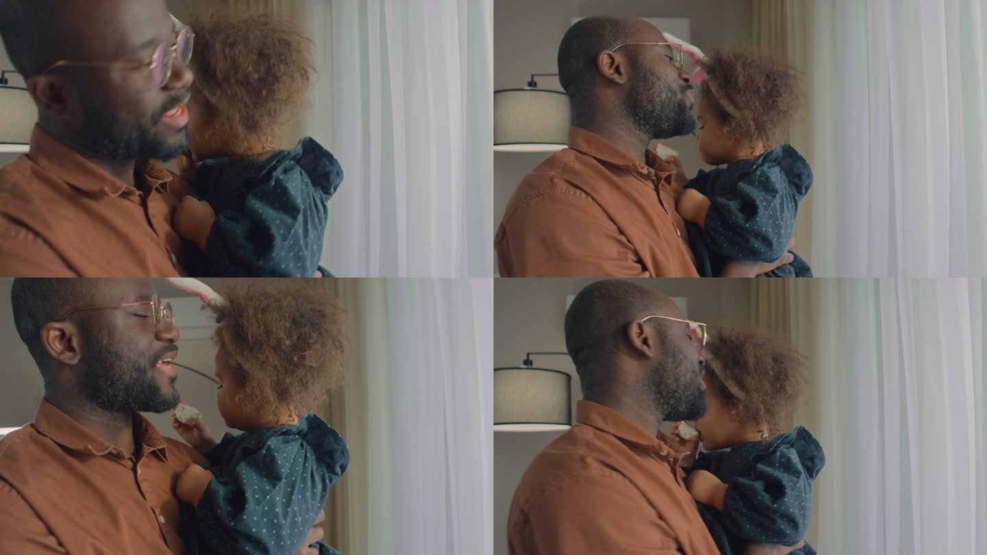 男人摇着女儿爸爸抱着孩子视频素材黑人家庭
