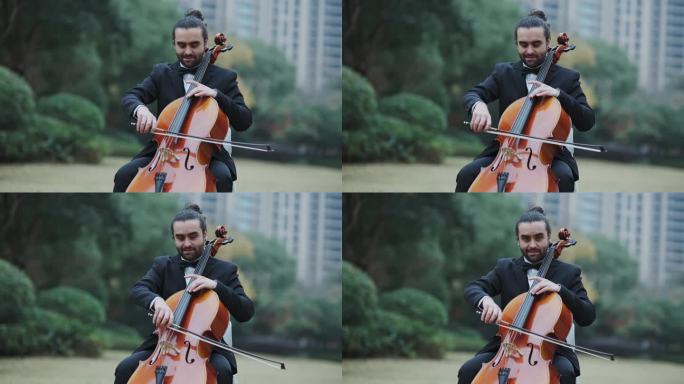 外国男子草坪演奏拉大提琴
