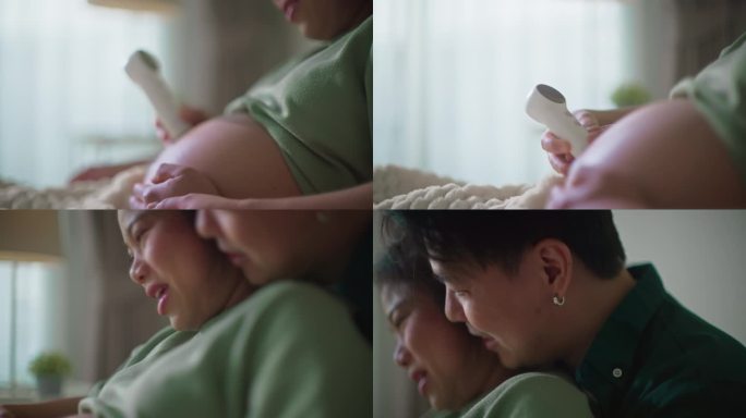 幸福的新婚夫妇亚洲恋人使用个人超声波扫描仪检查和听天使的声音，从婴儿怀孕在妈妈的肚子在家里的床上