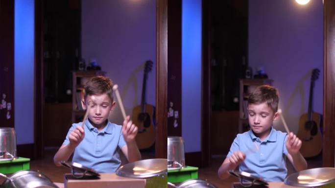 垂直视频男孩在家里玩架子鼓，男孩用鼓敲锅和盒子