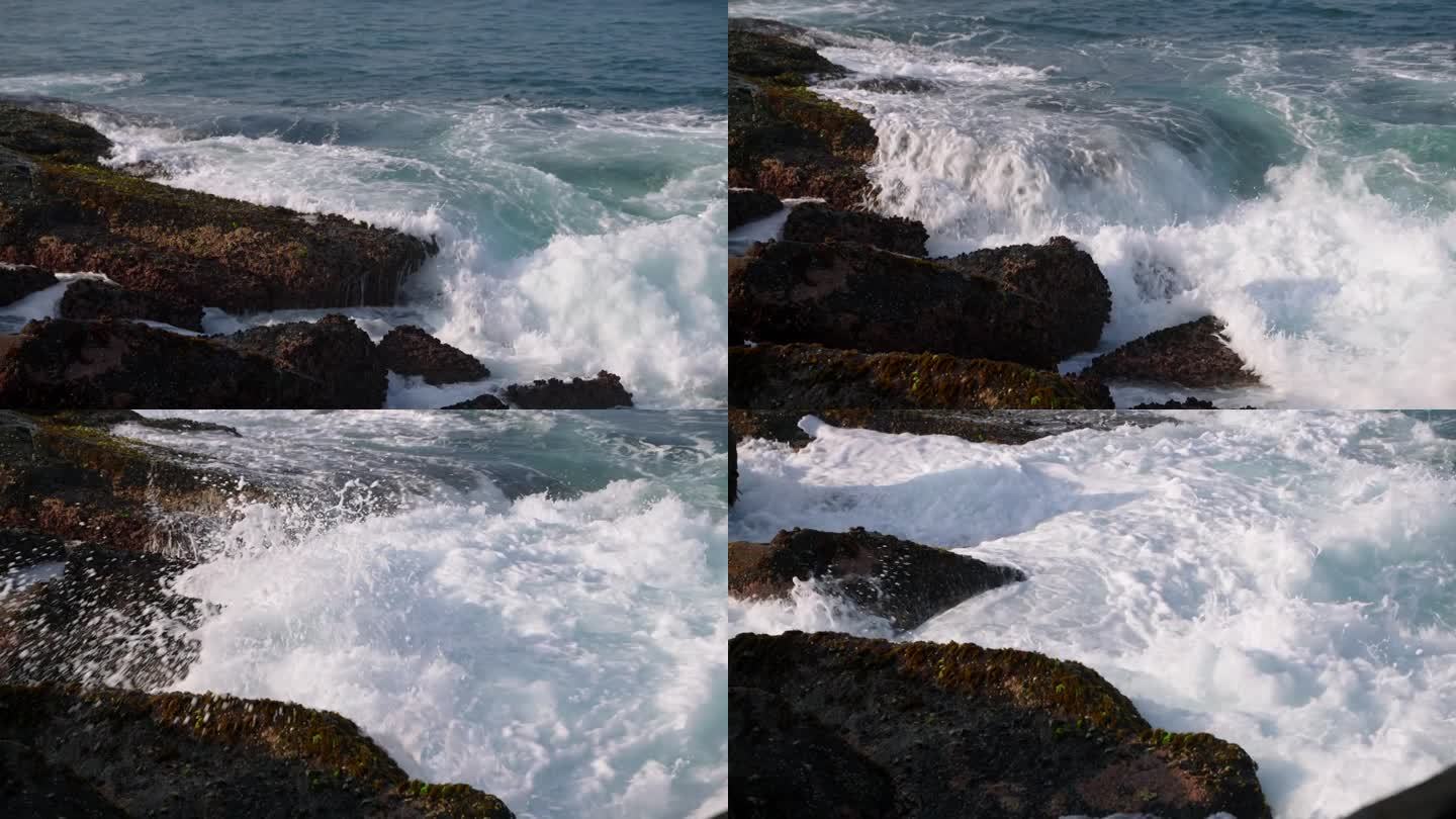 汹涌的海浪冲击着岩石海岸。沿海风光与泡沫潮汐，海洋的力量显示。电影观自然气候研究，生态旅游推广，休闲