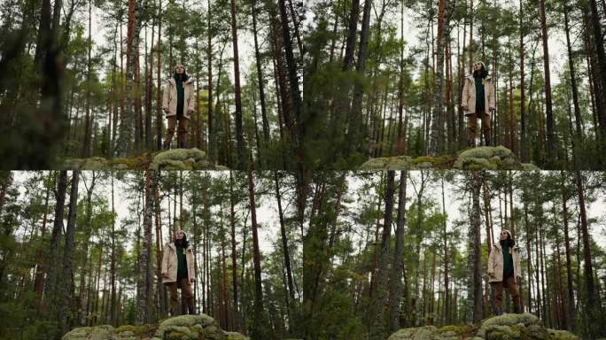 年轻的成年女子独自站在古老的高大的云杉在秋天的森林，旅游和旅游