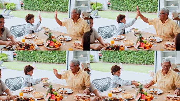 击掌，午餐和爷爷带着孩子在桌子上联系和庆祝，开心，微笑和老人做胜利的手势与男孩在家里的餐厅吃饭。