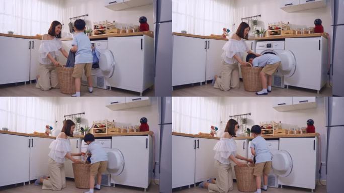 亚美母亲教小儿子在家里洗脏衣服。可爱的小男孩孩子帮助和学习父母妈妈把衣服放在洗衣机电器在家里。Dom