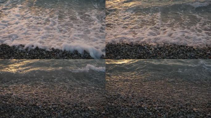 近距离拍摄的白色冲洗潮涌入和撤回的岩石北密歇根海滩