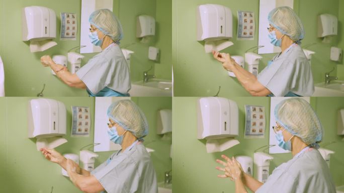 手术前，一位资深女外科医生按照绝育规则洗手。医生在进入手术室前先消毒并洗手干。手消毒。