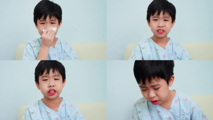 一个小男孩在医院病房里与感冒和持续的咳嗽作斗争。感到不适，用纸巾擦去鼻内的黏液。看护病人的护士在场。