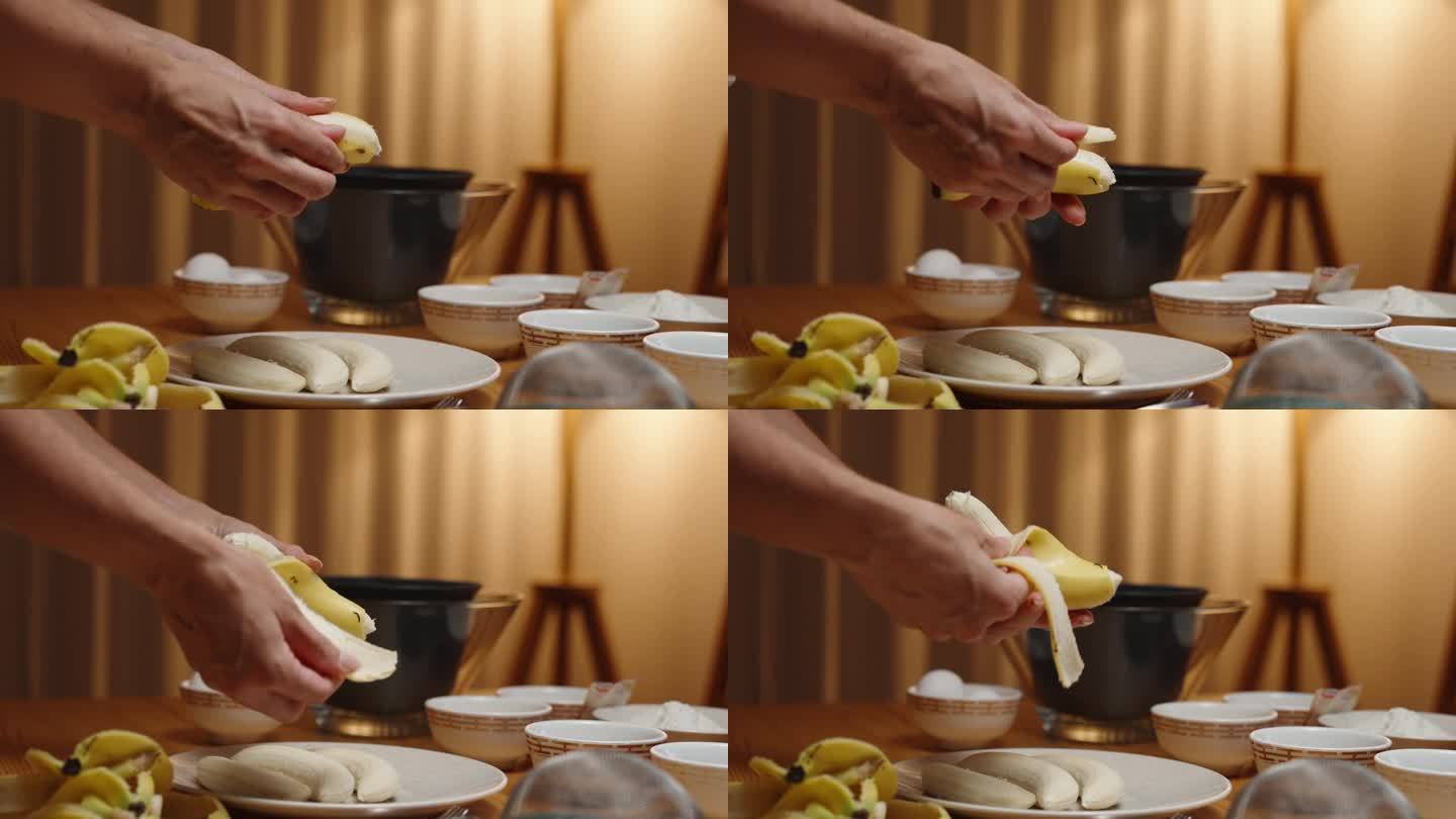 一个女人正在准备甜点，她正在剥香蕉，碗里的食材放在桌子上，温暖的灯光从一盏灯的背景。