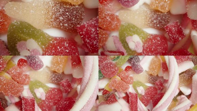 各种形状和口味的彩色软糖的混合物。前视图。多莉滑块极端特写。