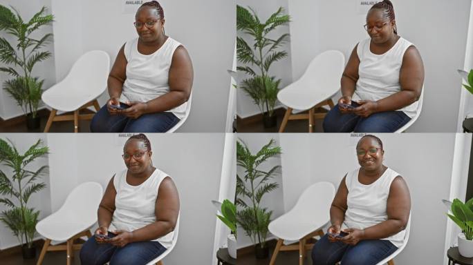 自信的非裔美籍女老板，梳着辫子，坐在候诊室里，开心地用智能手机发短信