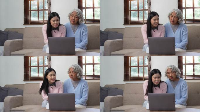 孙女帮助老太太，教她使用笔记本电脑