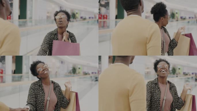 快乐的非裔美国女士拖着男人去购物中心，和男友聊天，询问或购买手提袋的慢动作肖像
