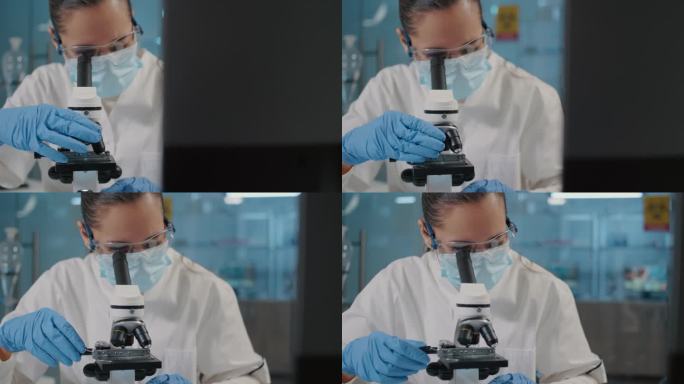 在科学实验室使用显微镜的专家