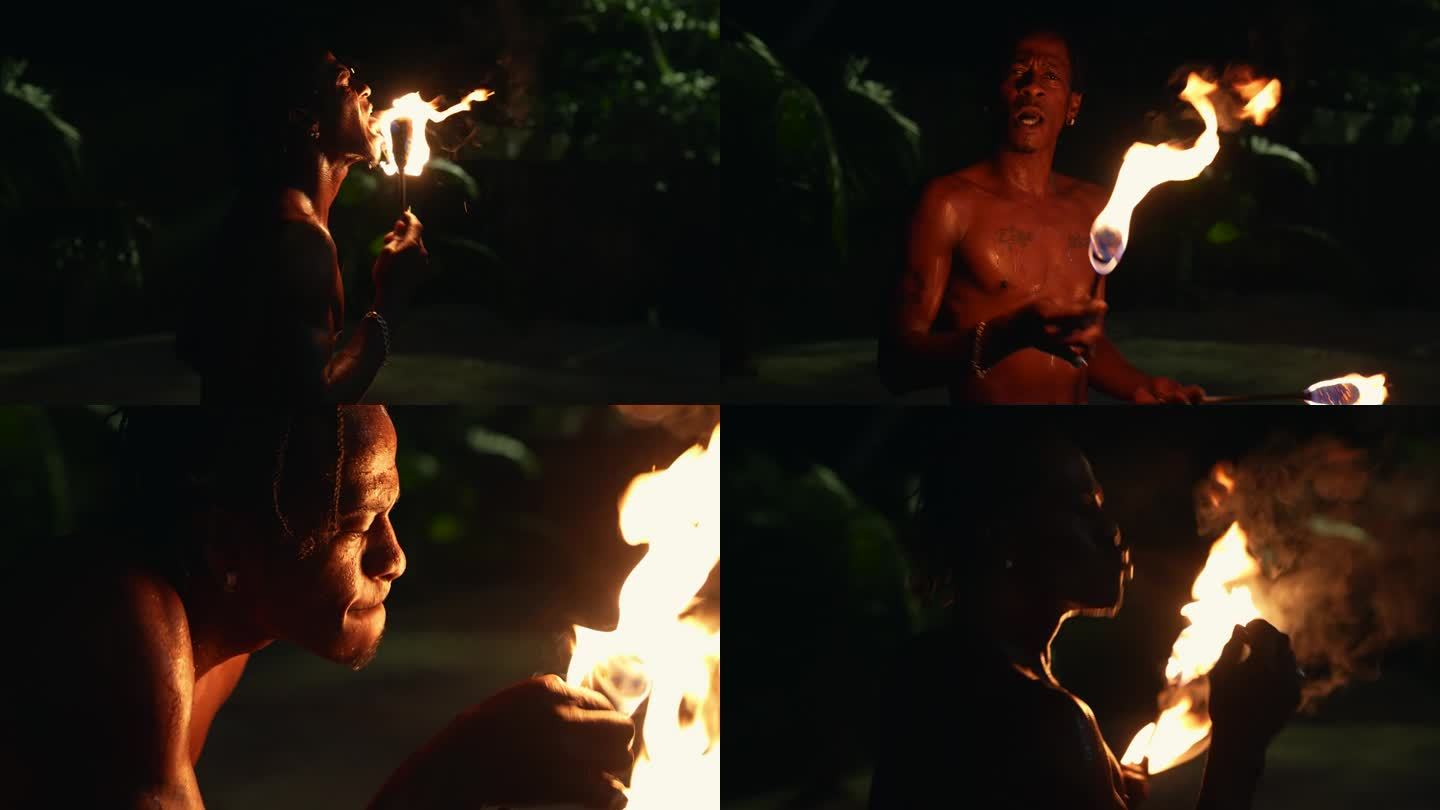 牙买加黑人表演者正在进行火表演、火表演、喷火、火舞、玩火、吃火。蒙特哥湾，牙买加
