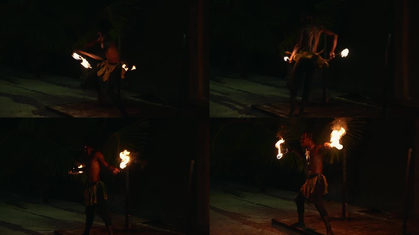 牙买加黑人男表演者正在做火表演、火表演、喷火、火舞和玩火。蒙特哥湾，牙买加