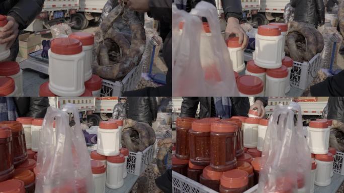 新疆吐鲁番集市美食地摊美食小吃酱料罐人文