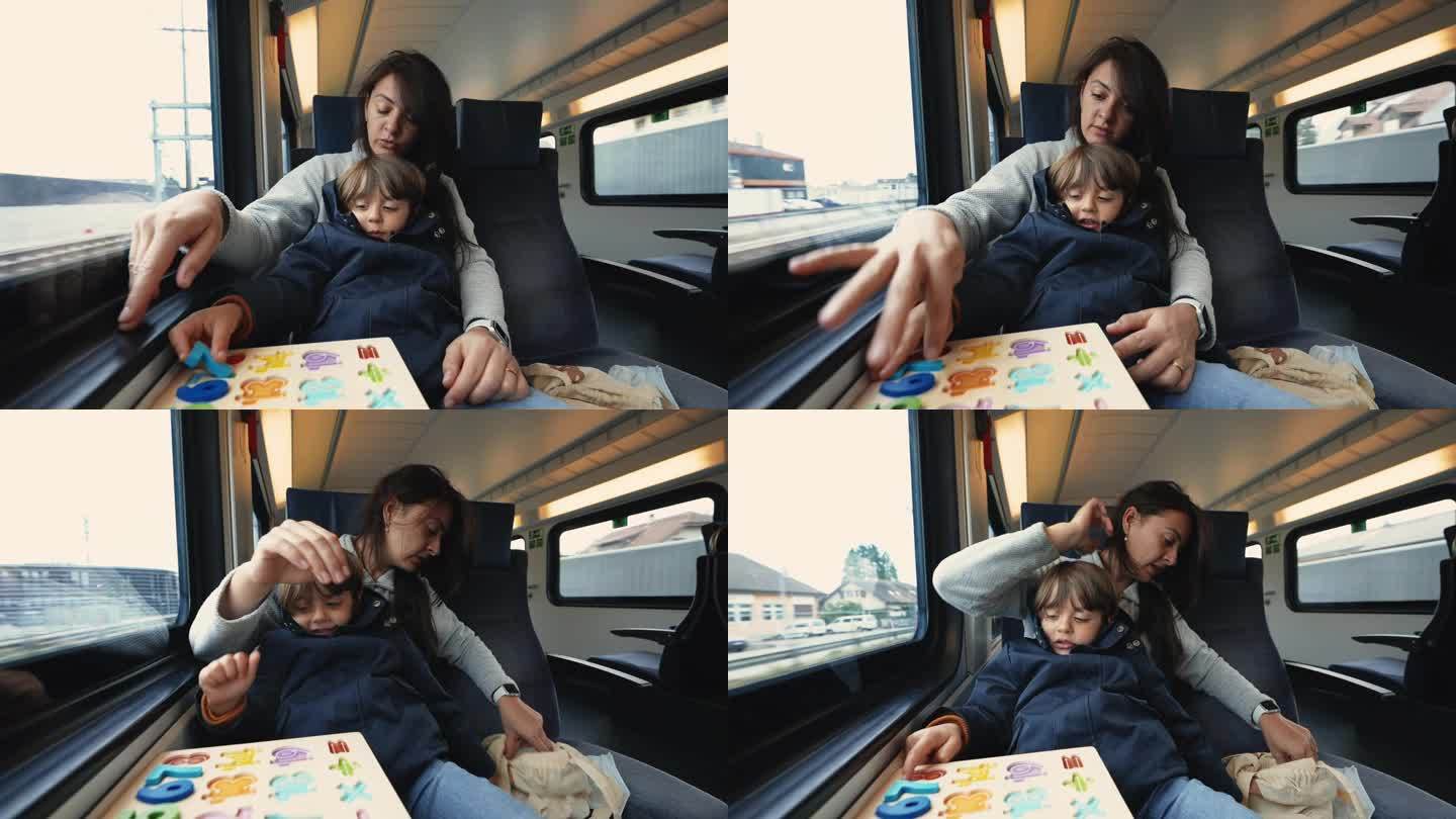 妈妈和孩子坐高铁旅行，做学校活动来打发时间