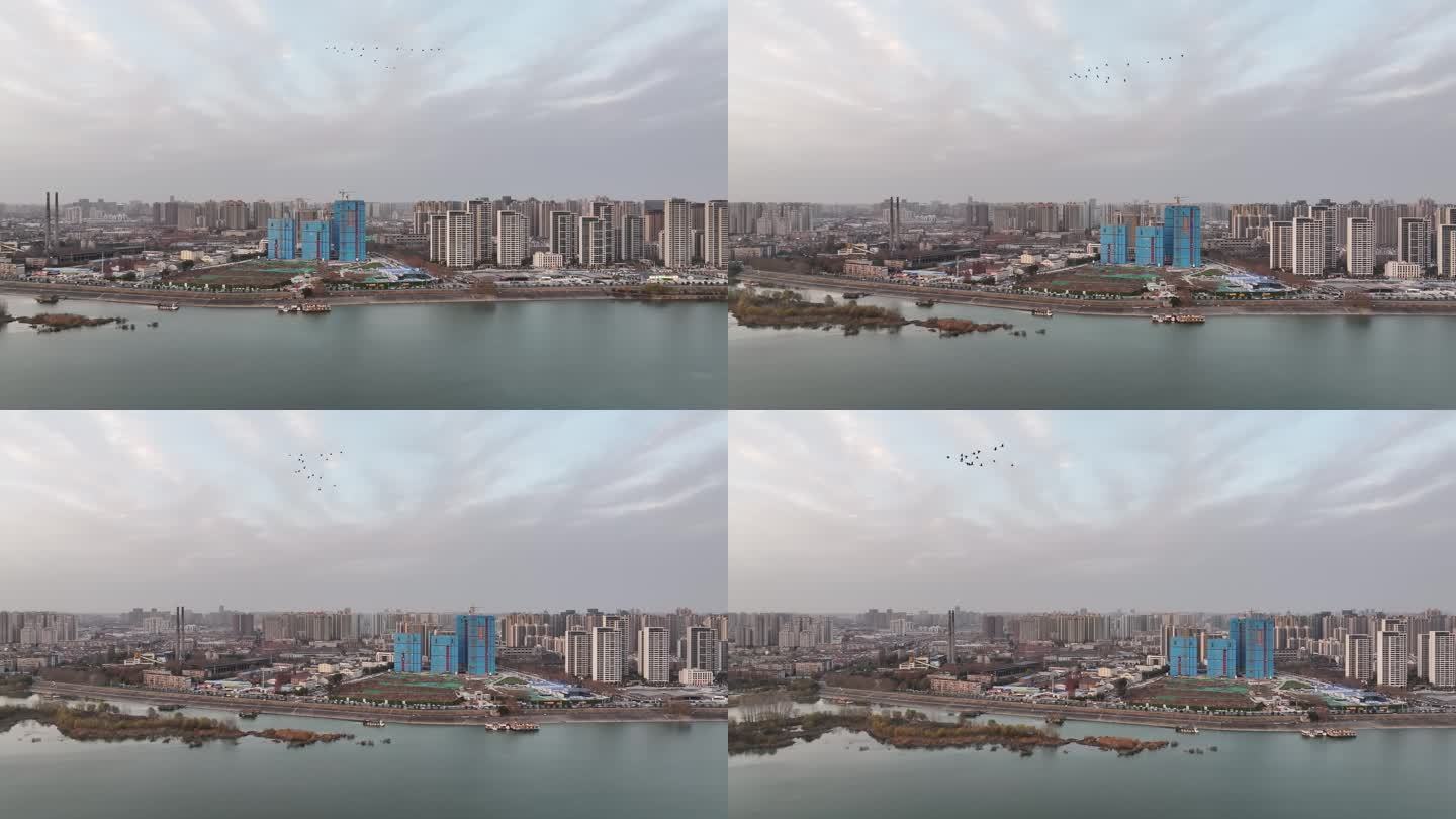 航拍鸟群飞过襄阳樊城汉江城市风光