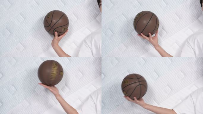 在床垫上转篮球