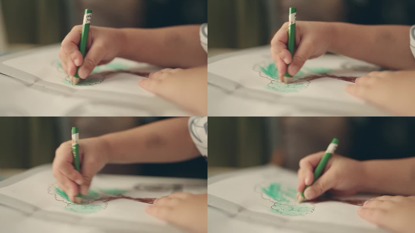 多彩的学习:一个年轻艺术家在家里的特写，一个亚洲男孩享受铅笔彩色绘画
