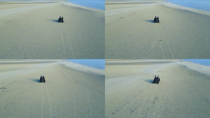 沙滩驾驶越野车奔驰在沙滩山的车子自由自在