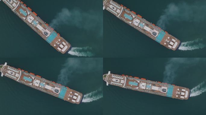 从一艘转向右舷的大型游船的烟囱中冒出的烟自顶向下旋转射击