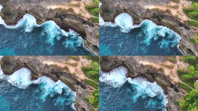 鸟瞰特写镜头，海浪冲击着印尼巴厘岛努沙佩尼达岛沿岸的岩石