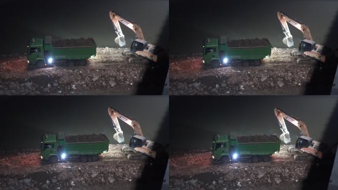 夜晚湖边施工渣土车清运挖掘机