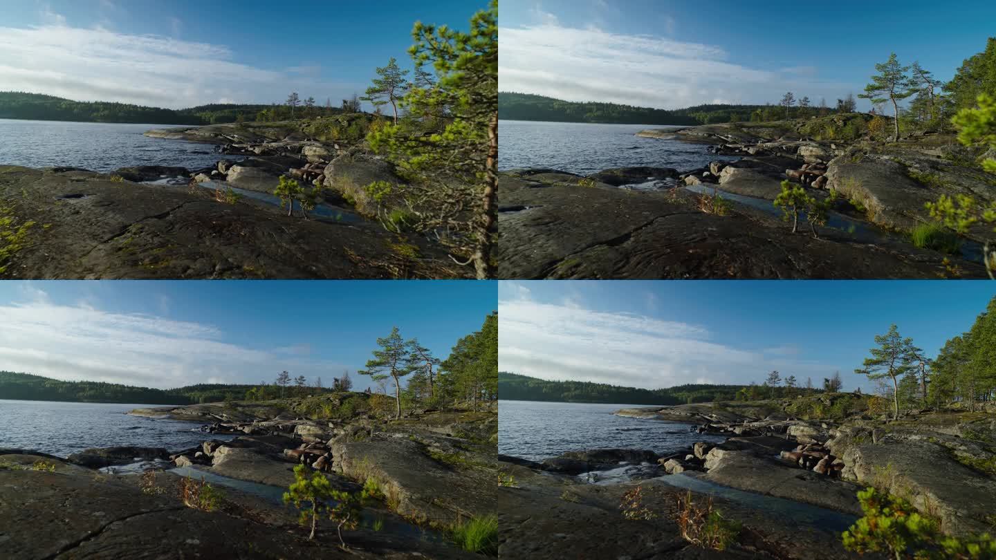 清晨在美丽的自然环境中旅行，北欧的石岸湖