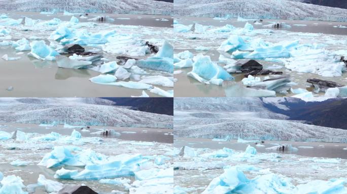 由于全球变暖导致的冰川迅速融化，冰山碎片漂浮在水中