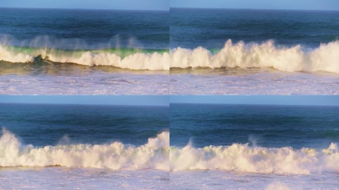 清晨的海浪以超级慢动作向浅滩翻滚。白色海沫
