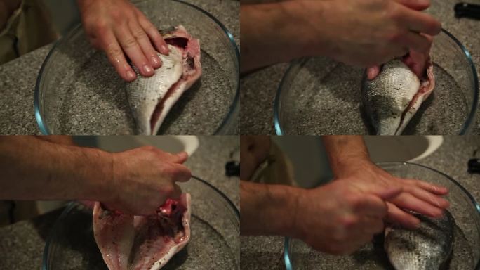 一名男子用盐和胡椒给鱼调味，烹饪的镜头